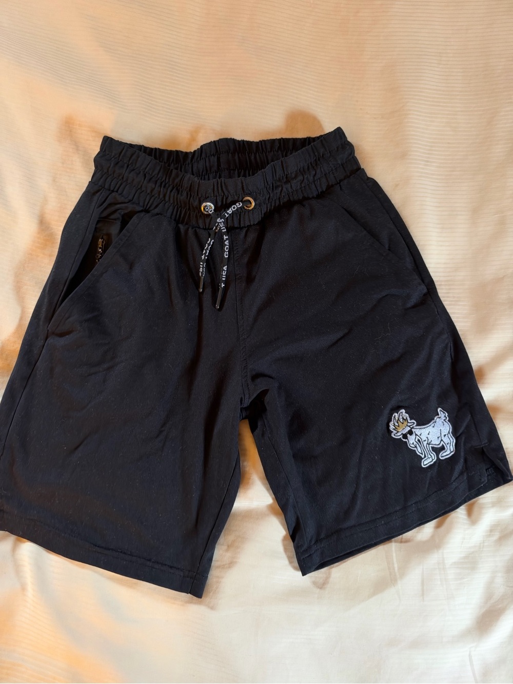 GOAT Kids Black Drawstring Casual Shorts with Embroidered Patch